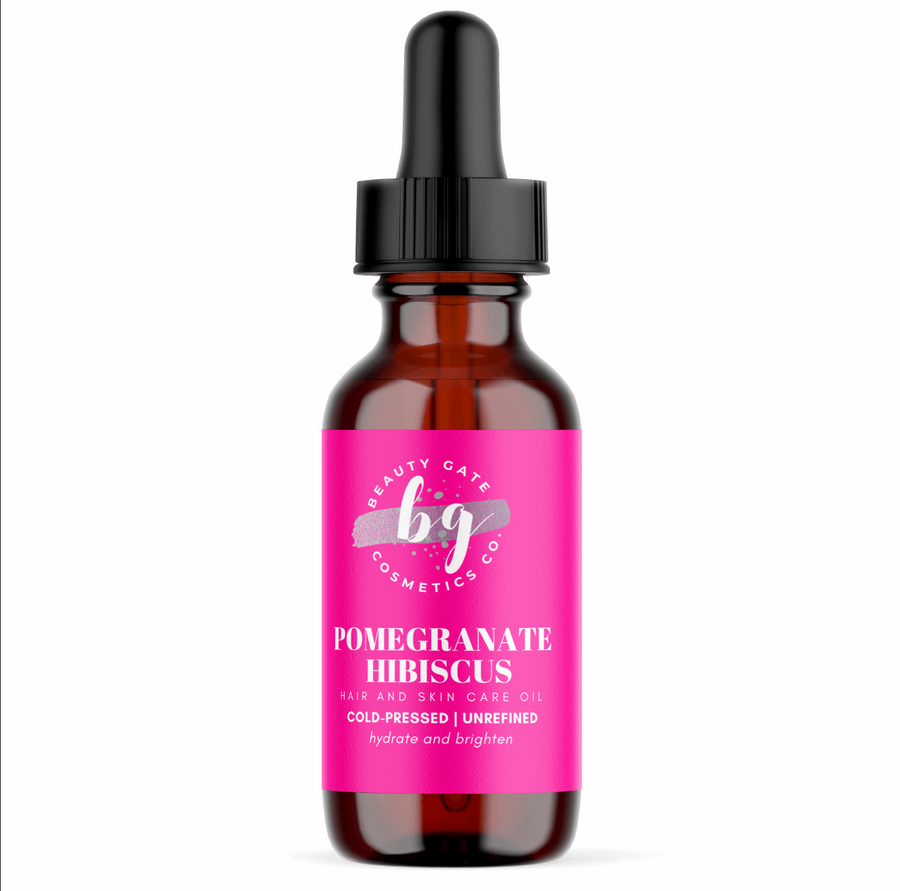 A bottle of natural Pomegranate Hibiscus Hair and Skin Care Oil by Beauty Gate Cosmetics.